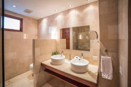 Shower, rainfall showerhead, designer toiletries, hair dryer