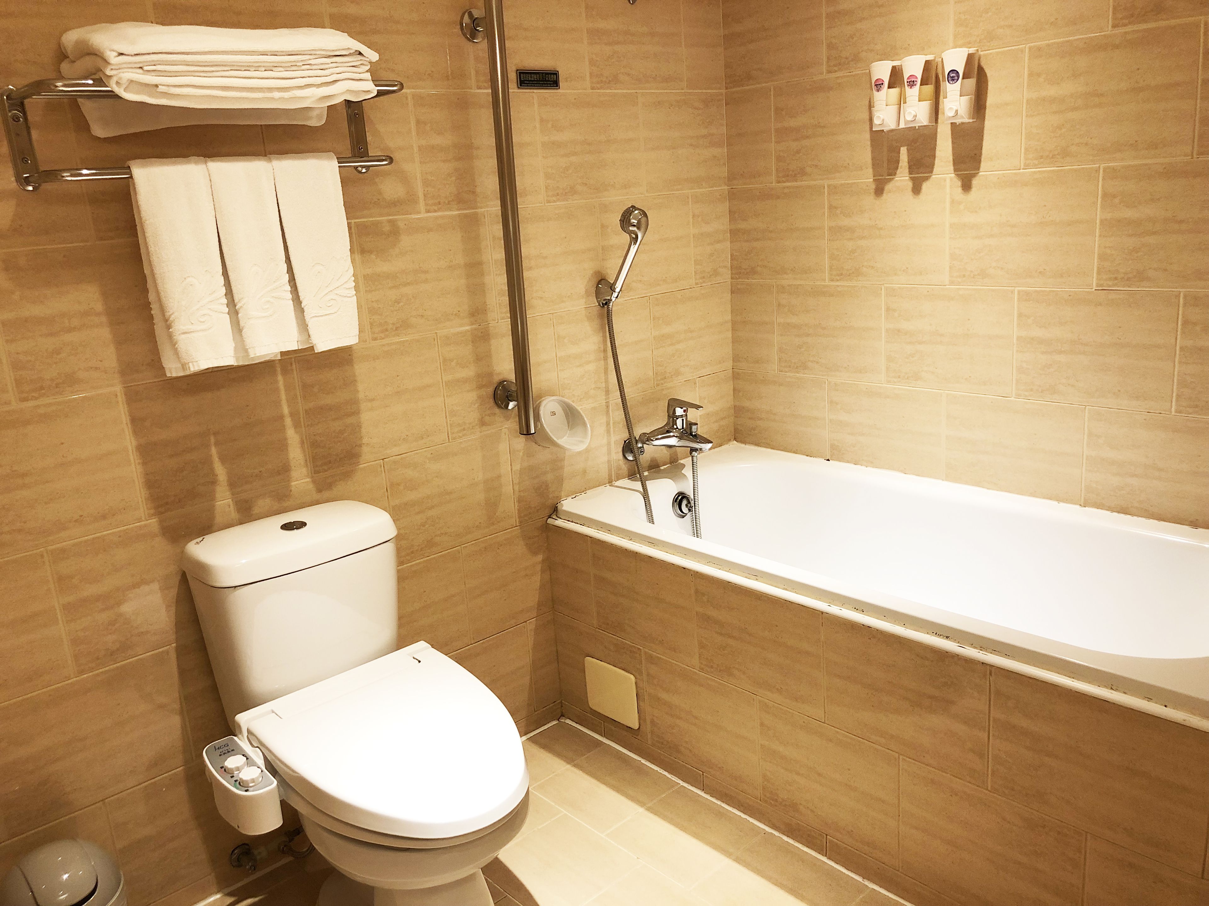 deluxe triple room | bathroom | hair dryer, towels, shampoo, toilet paper