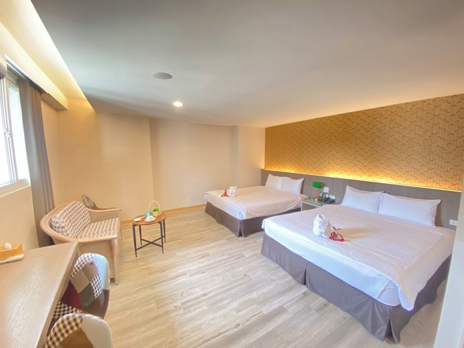 deluxe quadruple room | in-room safe, desk, laptop workspace, blackout curtains