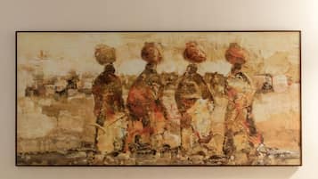 A painting with abstract figures and a textured background.