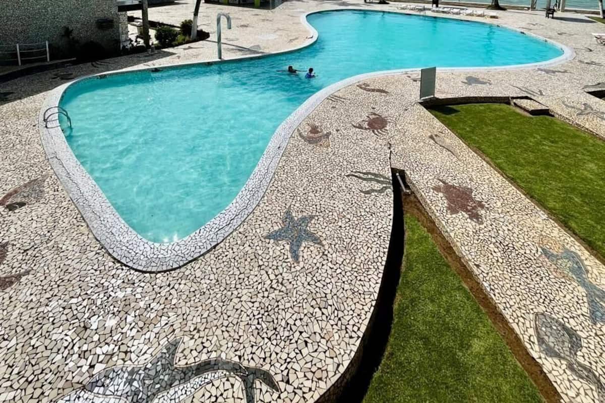 Outdoor pool, open 7:30 AM to 5:30 PM, pool umbrellas, pool loungers