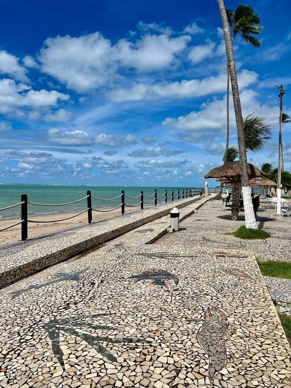 On the beach, white sand, beach umbrellas, beach towels