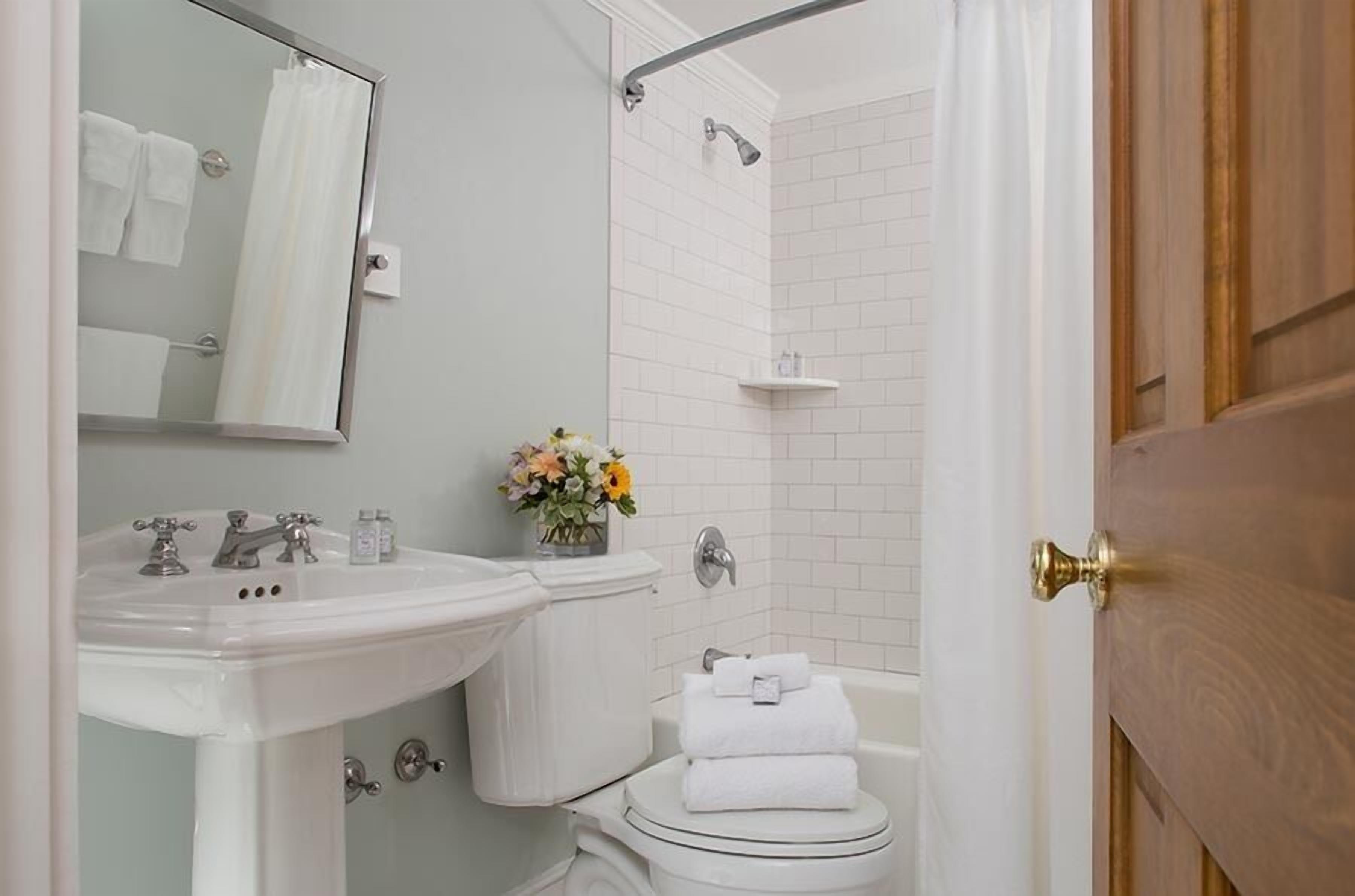 deluxe room, 1 king bed | bathroom | separate bathtub and shower, designer toiletries, towels