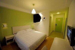 A bedroom with a bed, bedside tables, a desk, and a TV. - ACG Life Theme Hotel Yunhe Plaza Branch (HANGZHOU)