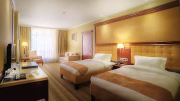 Deluxe Twin Room | Minibar, in-room safe, desk, iron/ironing board