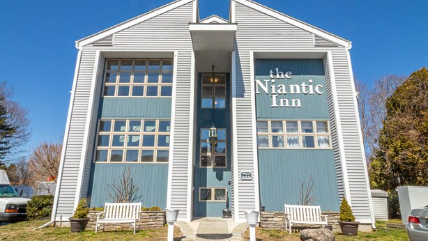 A building with a sign reading "the Nantic Inn".