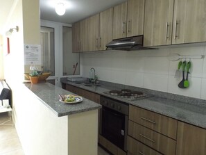 Fridge, microwave, oven, stovetop - Condominio Mirador El Faro (La Serena)