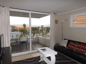Apartment, 2 Bedrooms, Ocean View | Living area | 32-inch LED TV with satellite channels, TV - Condominio Mirador El Faro (La Serena)
