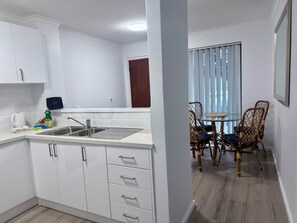 Premier Family Apartment, 2 Bedrooms (1 Queen, 1 Tri-bunk and 1 Sofa bed) | Private kitchen | Full-size fridge, microwave, oven, stovetop - Scarborough & Absolutely Beachfront (Scarborough)