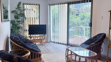 Premier Family Apartment, 2 Bedrooms (1 Queen, 1 Tri-bunk and 1 Sofa bed) | Living area | LED TV, DVD player