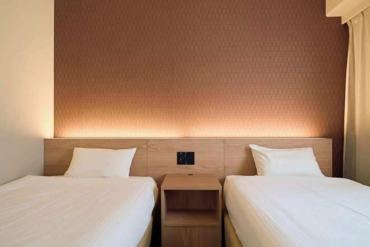 Laptop workspace, iron/ironing board, free wired Internet, bed sheets