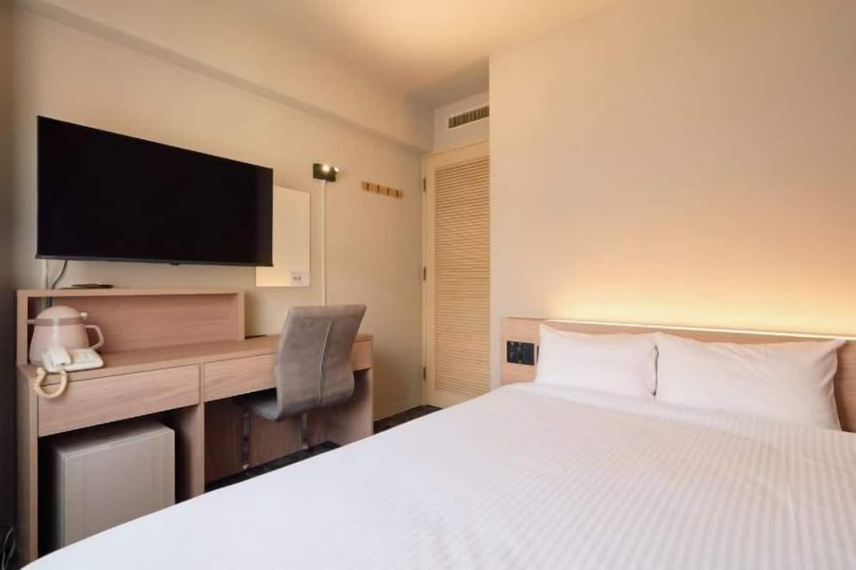 Laptop workspace, iron/ironing board, free wired Internet, bed sheets
