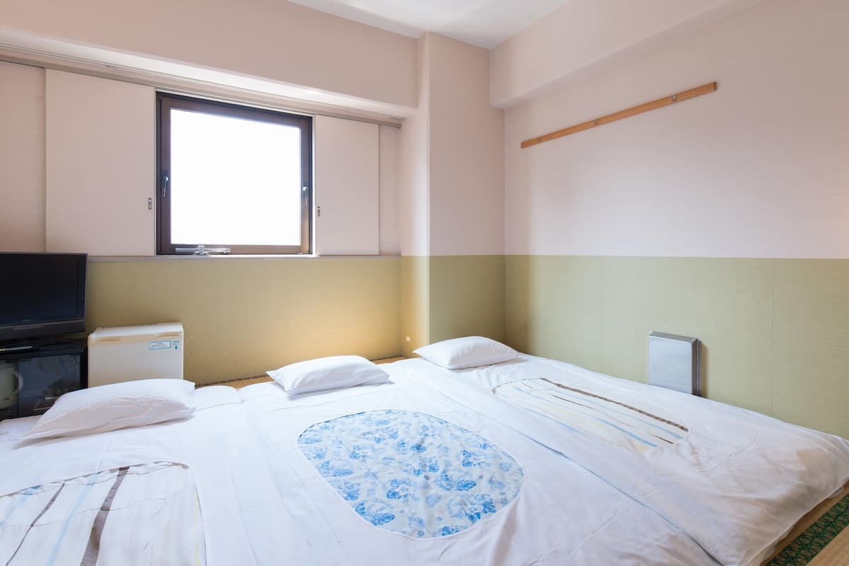 Laptop workspace, iron/ironing board (on request), bed sheets