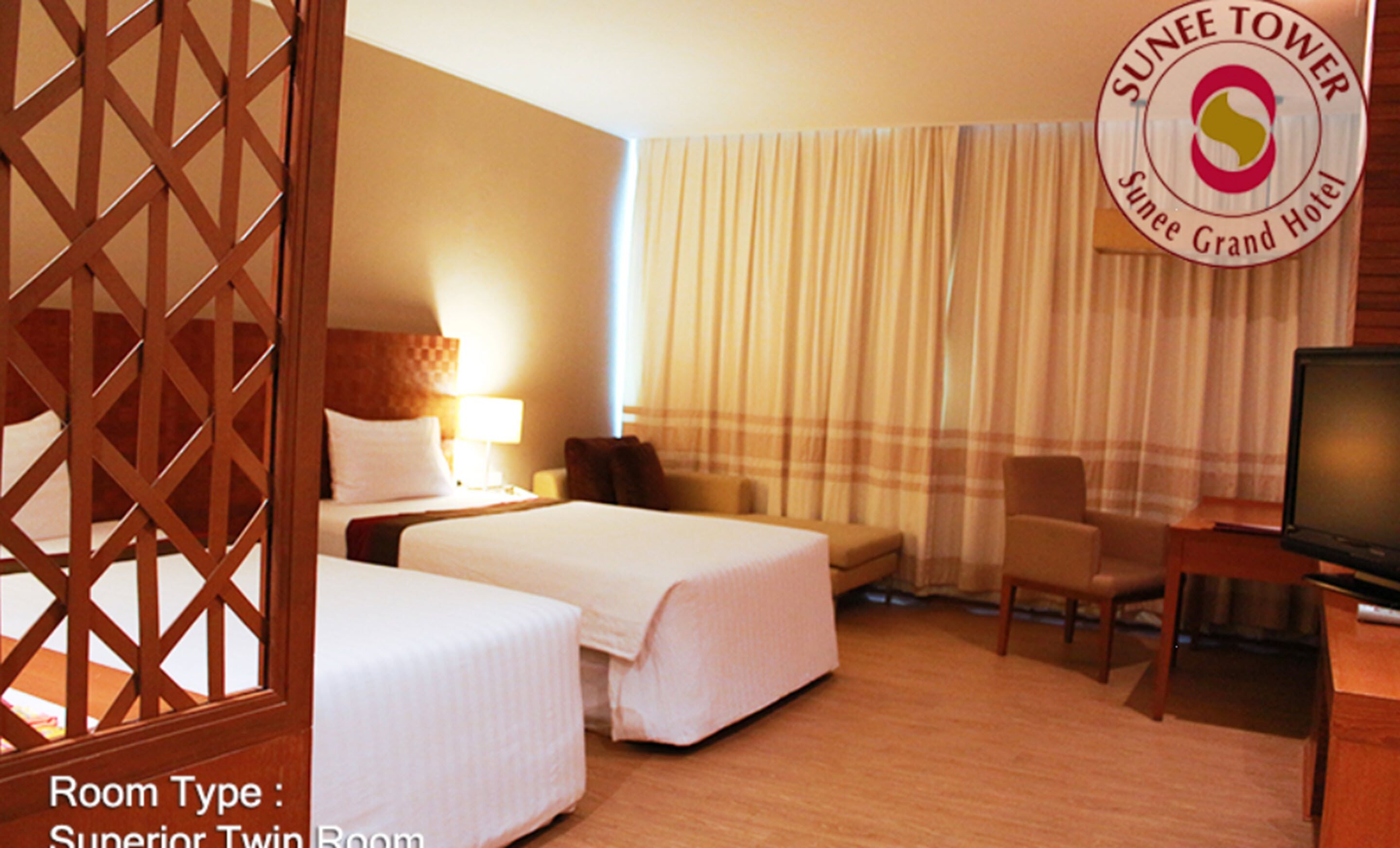 A Superior Twin Room with two beds, a TV, a desk, and a chair.