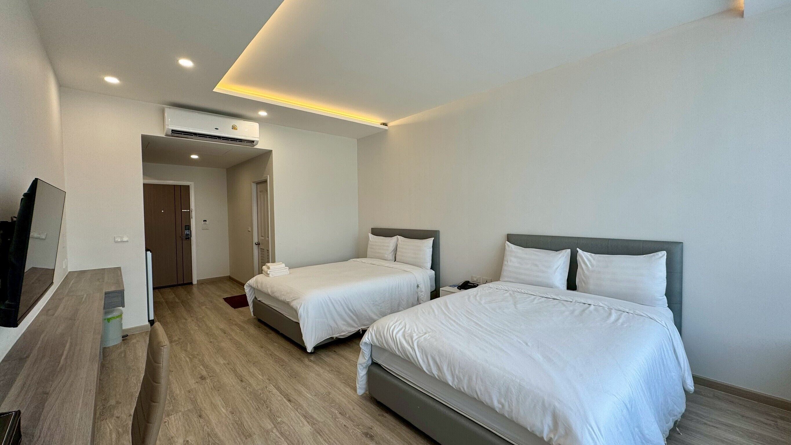 Premier kamer, 2 queensize bedden, uitzicht op park | Een minibar, een bureau, gratis wifi, beddengoed