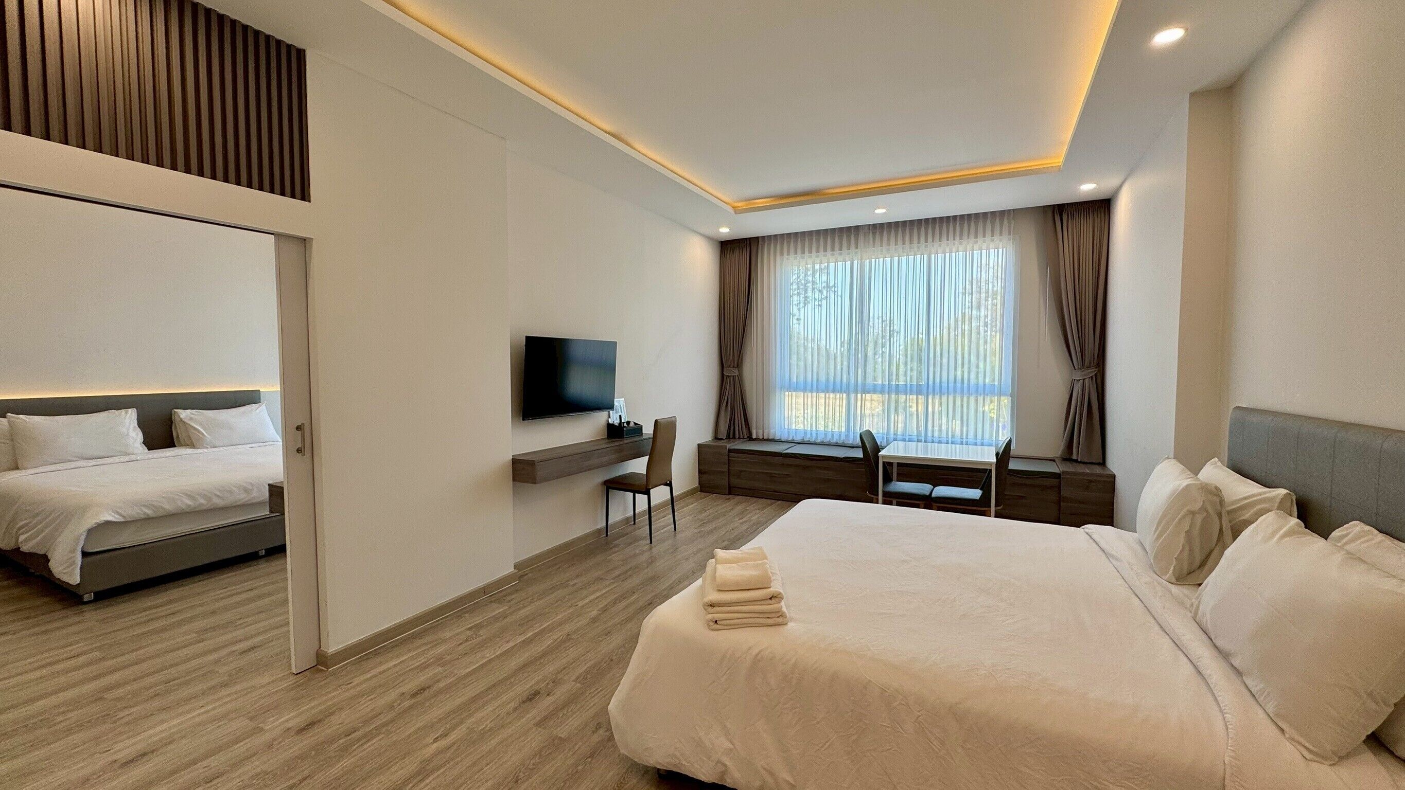 Family Room, 2 Bedrooms, Park View | Minibar, desk, free WiFi, bed sheets