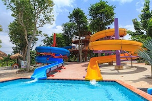 A water park with multiple slides and a pool. - Khaoyai Fantasy Resort (Pak Chong)