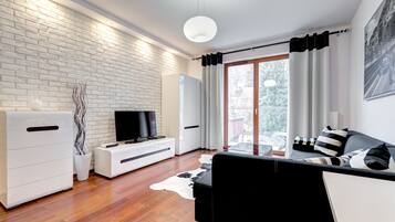 Comfort Apartment, 1 Bedroom, Balcony (4 adults) | Living area | 40-inch flat-screen TV with cable channels, TV