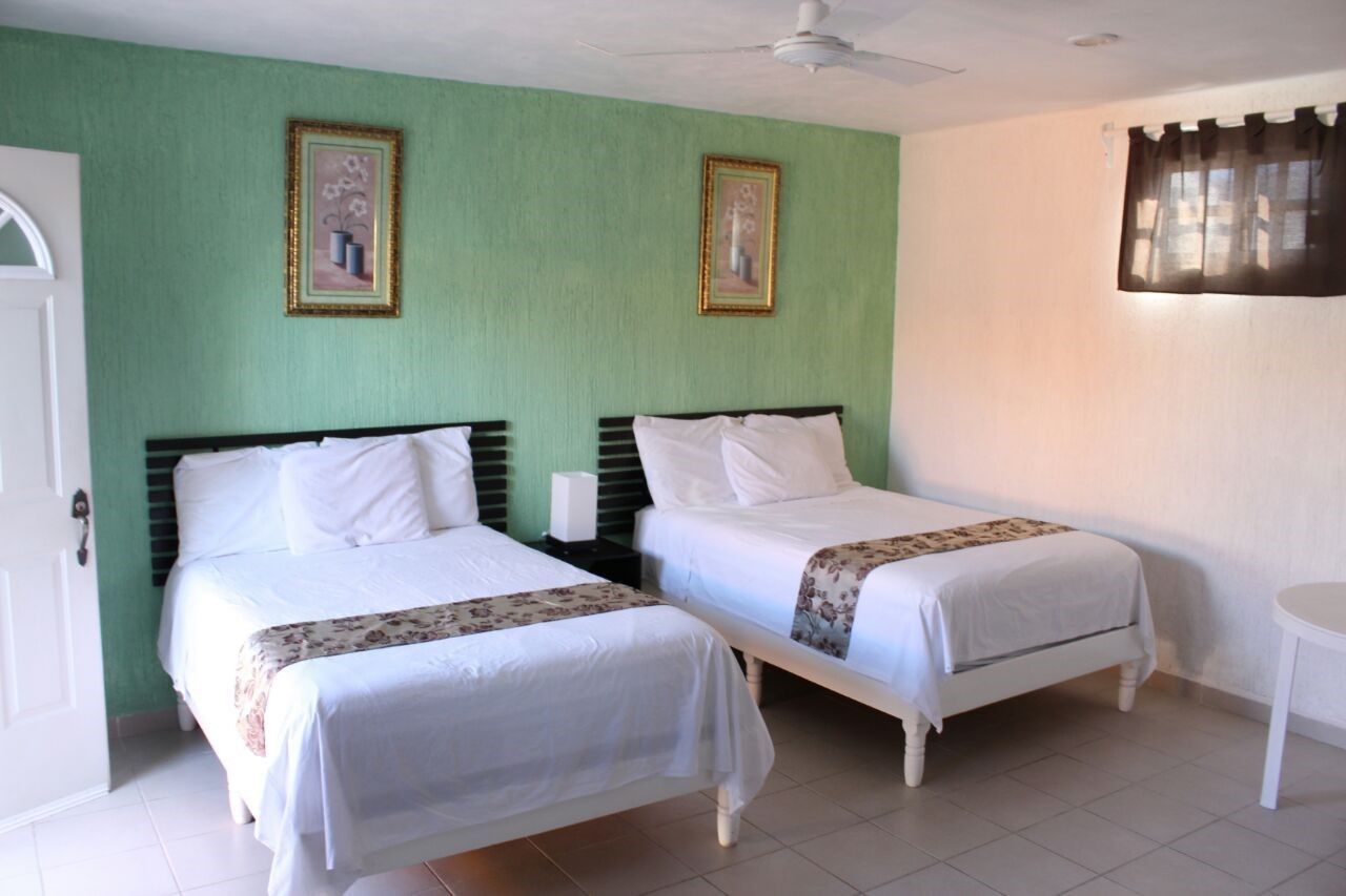 HABITACION CUADRUPLE  | Bộ đồ giường cao cấp, nệm có lớp đệm bông, két bảo mật tại phòng 