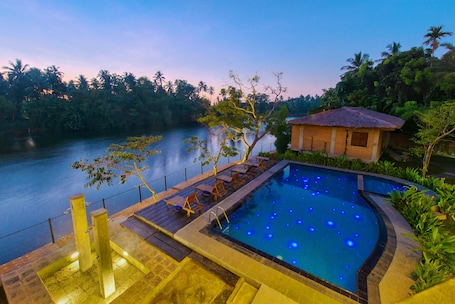 Outdoor pool, open 6:00 AM to 6:00 PM, sun loungers. Karunakarala Ayurveda Resort
