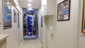 A hotel corridor with a sign reading "HOTEL" and "Happy New Year." - Hotel Ekol (Istanbul)