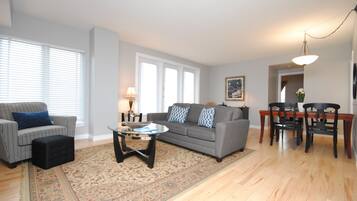 Premier Suite, 1 Bedroom | Living room | Flat-screen TV, DVD player