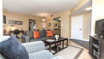 Premier Suite, 1 Bedroom | Living area | Flat-screen TV, DVD player