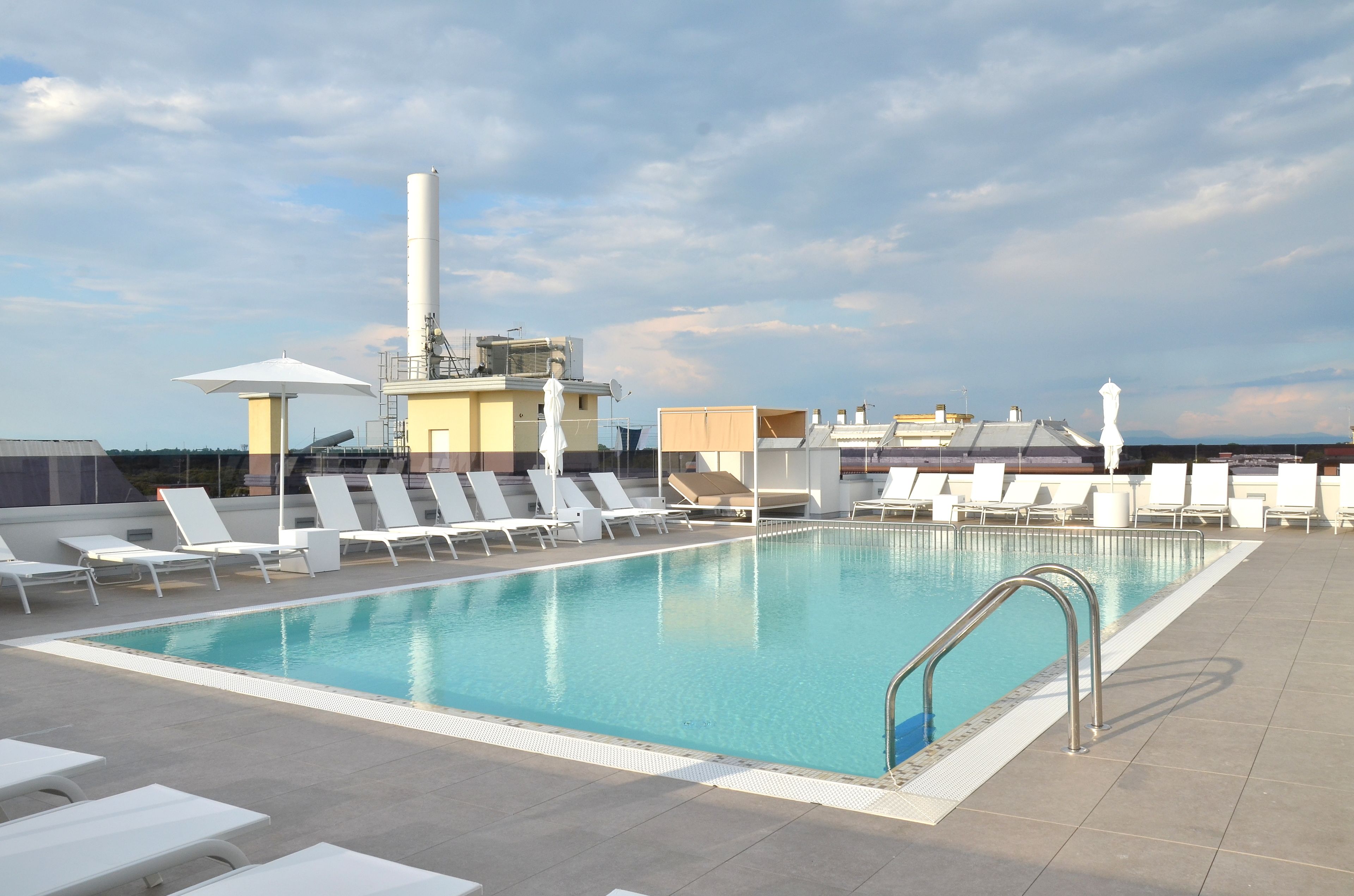 seasonal outdoor pool, a rooftop pool, pool loungers