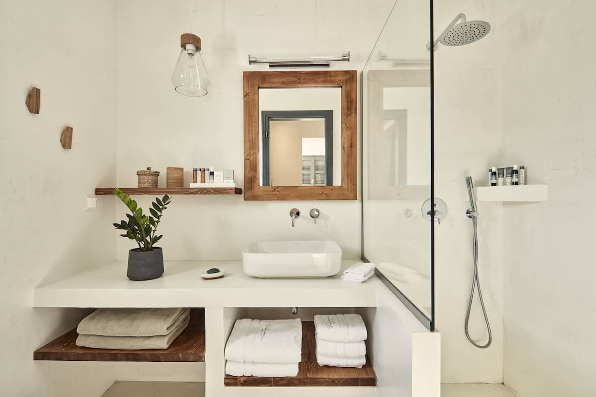 junior suite | bathroom | shower, free toiletries, hair dryer, bathrobes