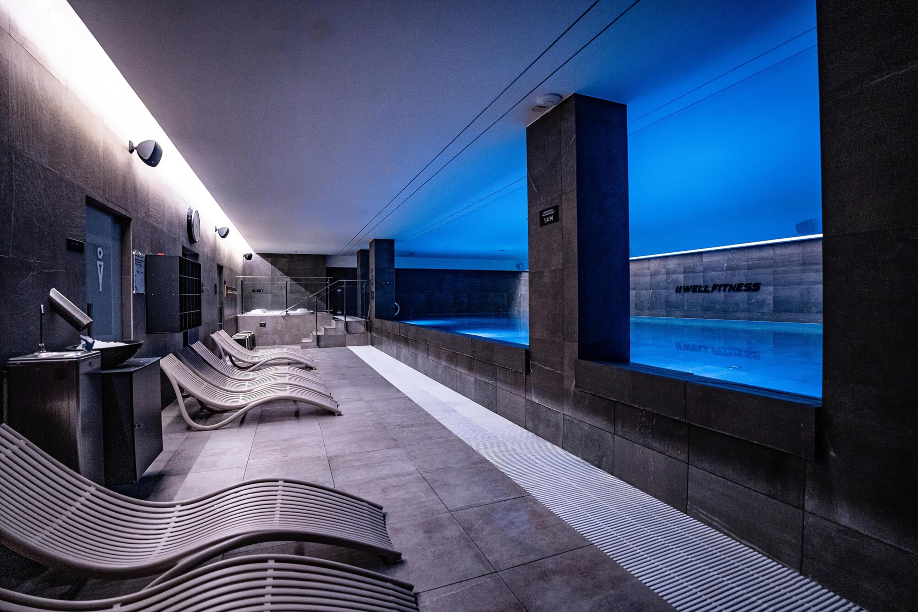 Indoor pool, open 9:00 AM to 9:00 PM, pool loungers, lifeguards on site