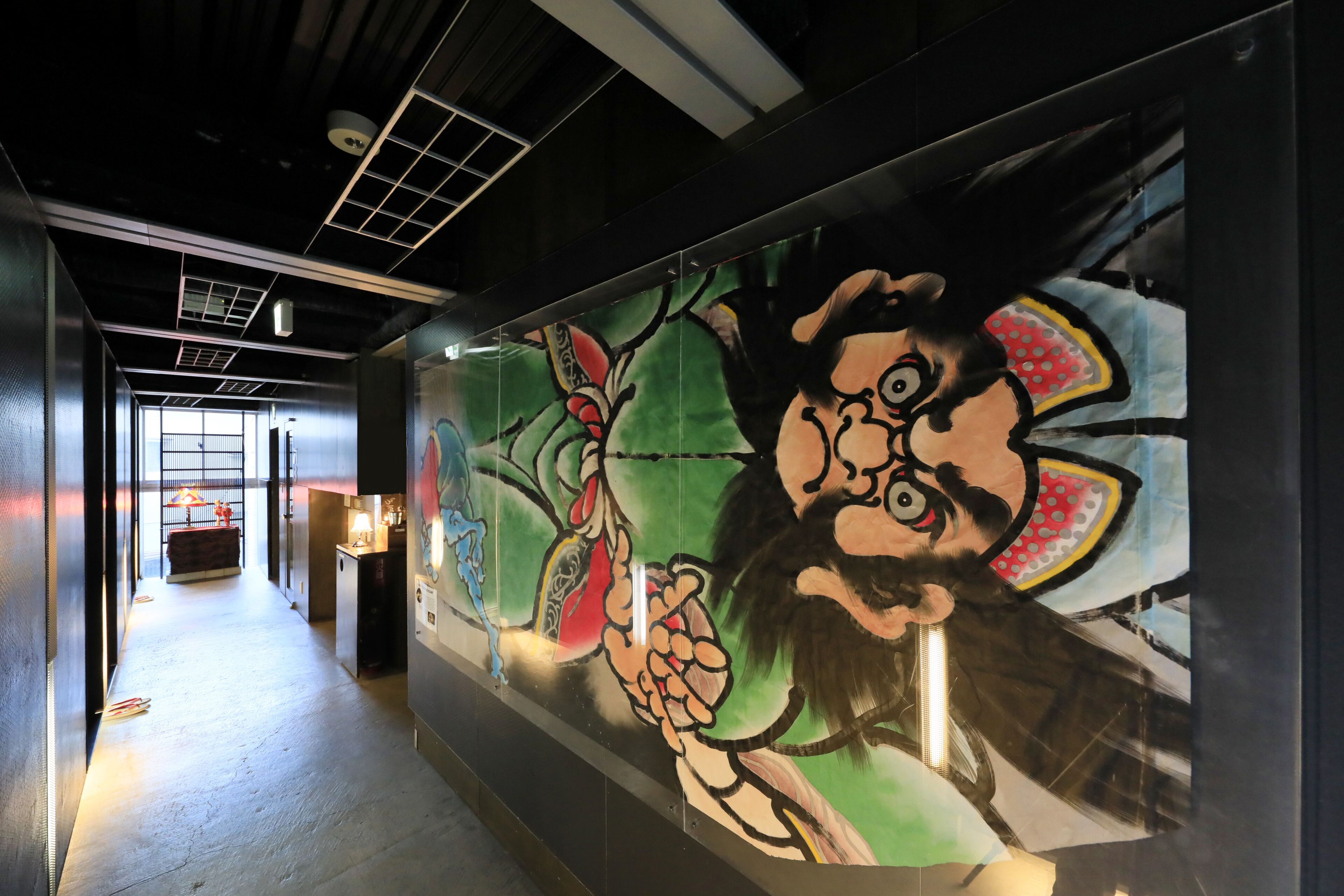 A hallway with a mural of a cartoon character.