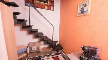 Quadruple Room | Living room | Flat-screen TV