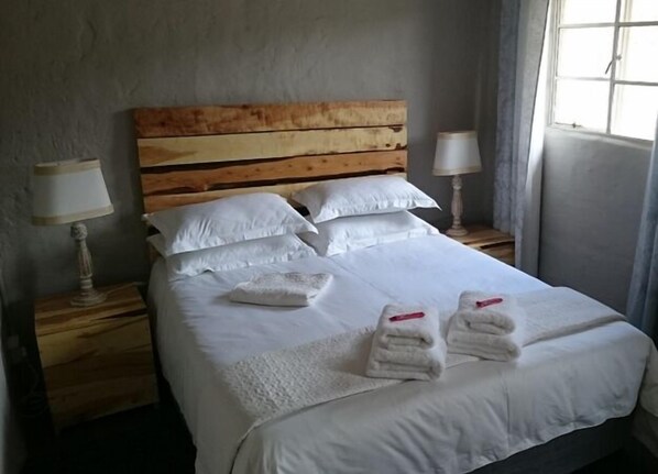 Egyptian cotton sheets, premium bedding, down duvets, minibar