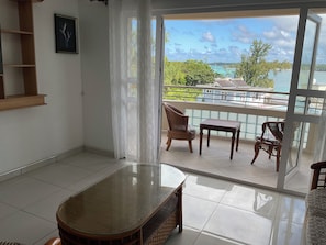 Family Penthouse, 2 Bedrooms, Ocean View | Living area | 25-inch flat-screen TV with satellite channels, TV