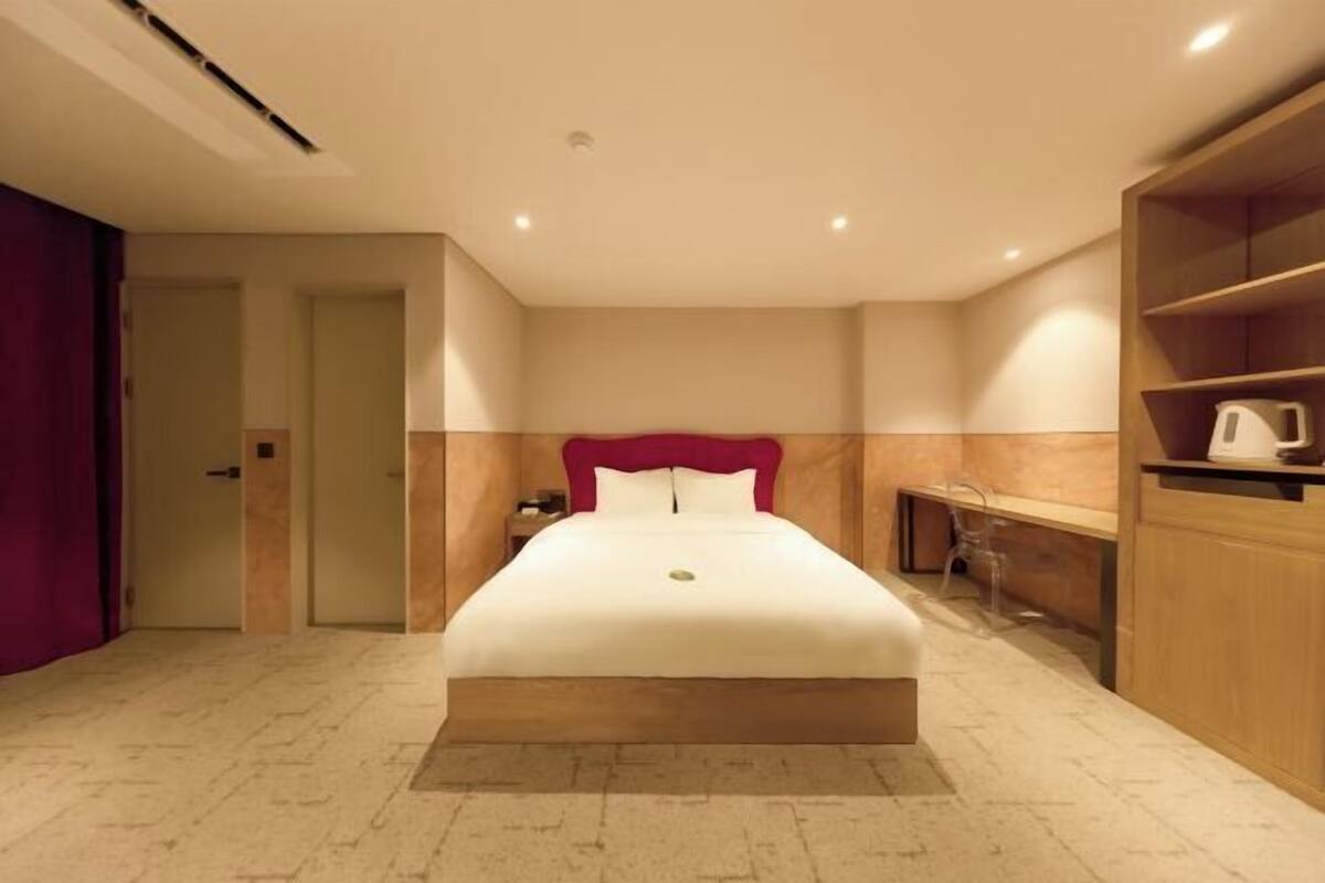Premium bedding, desk, laptop workspace, blackout curtains