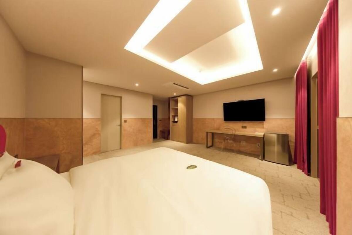 Premium bedding, desk, laptop workspace, blackout curtains