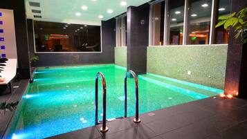 Indoor pool, outdoor pool, pool umbrellas, sun loungers