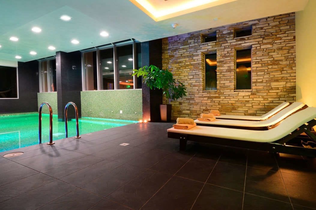 indoor pool, outdoor pool, pool umbrellas, pool loungers