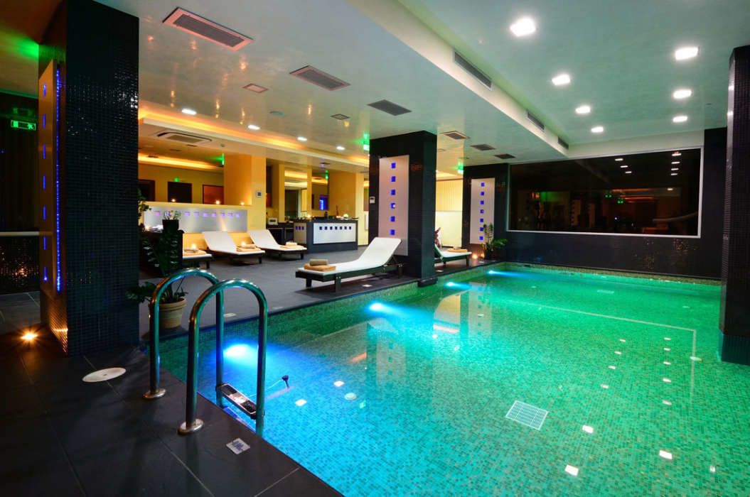indoor pool, outdoor pool, pool umbrellas, pool loungers