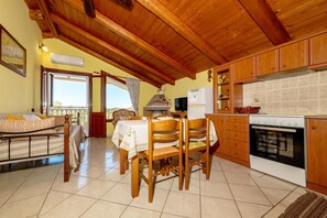 Apartment, 2 Bedrooms | Private kitchen | Fridge, stovetop, coffee/tea maker, electric kettle