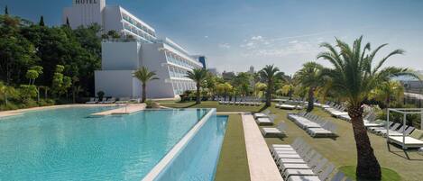 Seasonal outdoor pool, pool umbrellas, pool loungers