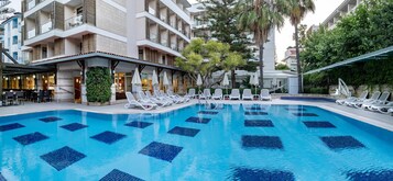 Indoor pool, seasonal outdoor pool, pool umbrellas, sun loungers