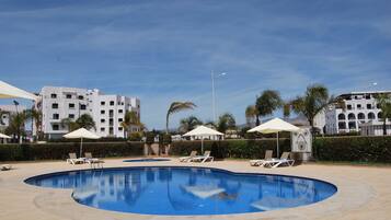 Outdoor pool, open 9:00 AM to 7:00 PM, pool umbrellas, sun loungers