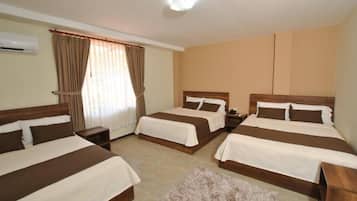 Comfort Triple Room | Premium bedding, individually decorated, desk, laptop workspace