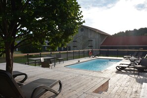 Seasonal outdoor pool, open 10 AM to 8 PM, pool umbrellas, pool loungers