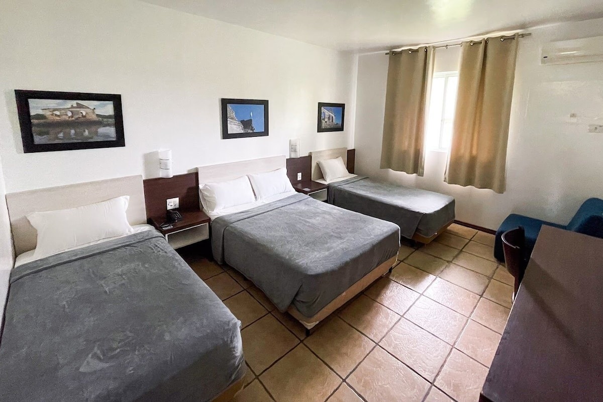 triple room, garden view | minibar, in-room safe, individually decorated, desk