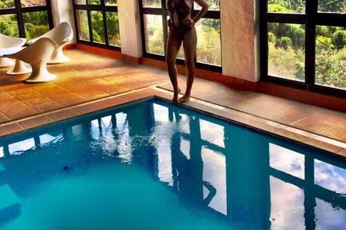 Indoor pool, outdoor pool, open 2:00 PM to 9:00 PM, pool umbrellas
