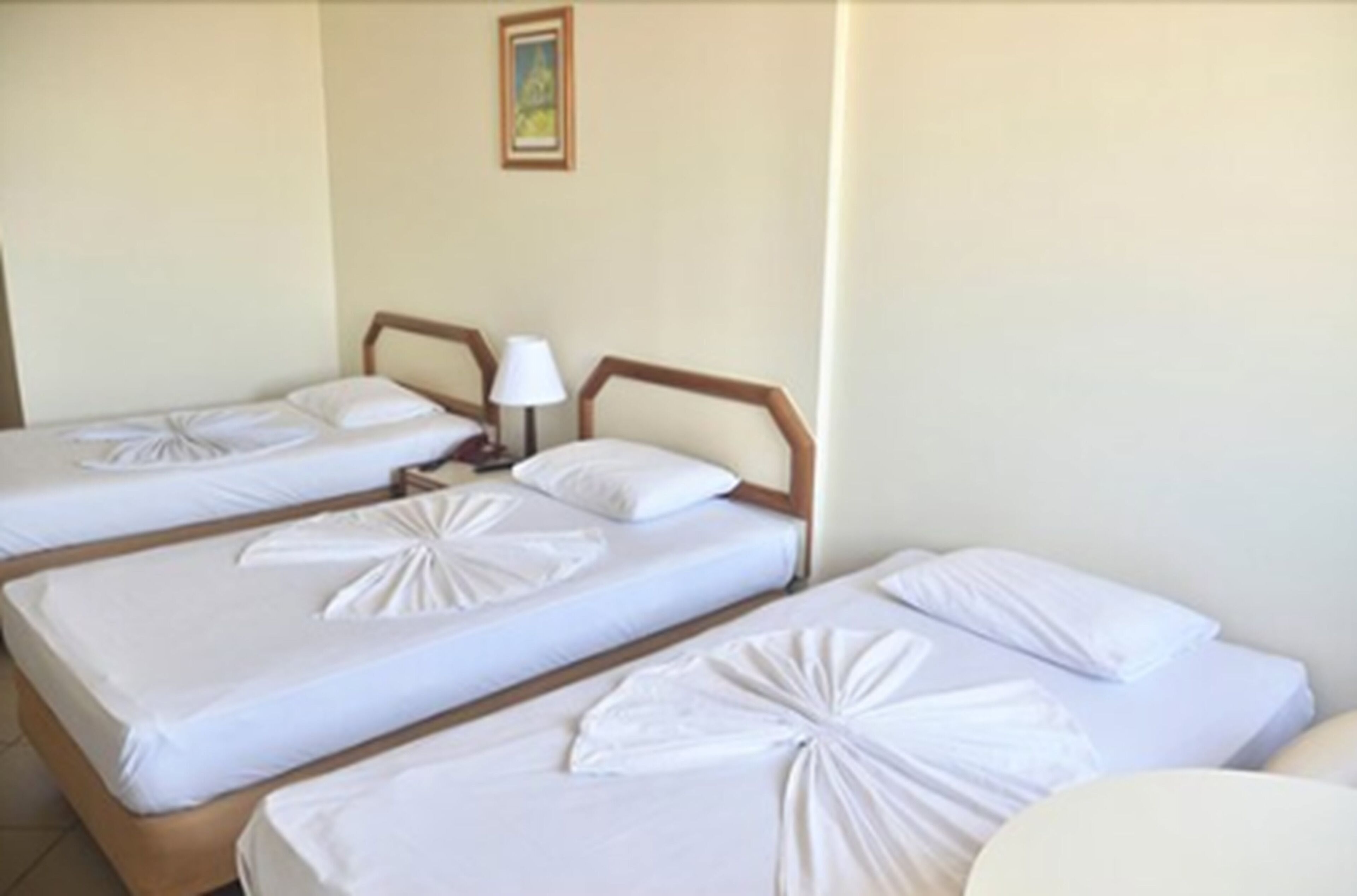 standard triple room, 3 single beds, non smoking, bay view | minibar, desk, blackout curtains, cots/infant beds