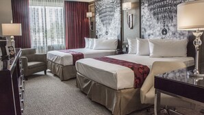 A hotel room with two beds, a desk, a chair, a coffee machine, and a large window with curtains. - The Delavan Hotel & Spa (Bowmansville)