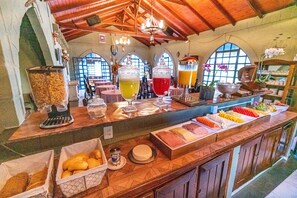 Enjoy a delicious breakfast spread at our hotel's buffet, featuring a variety of fresh fruits, pastries, and juices.